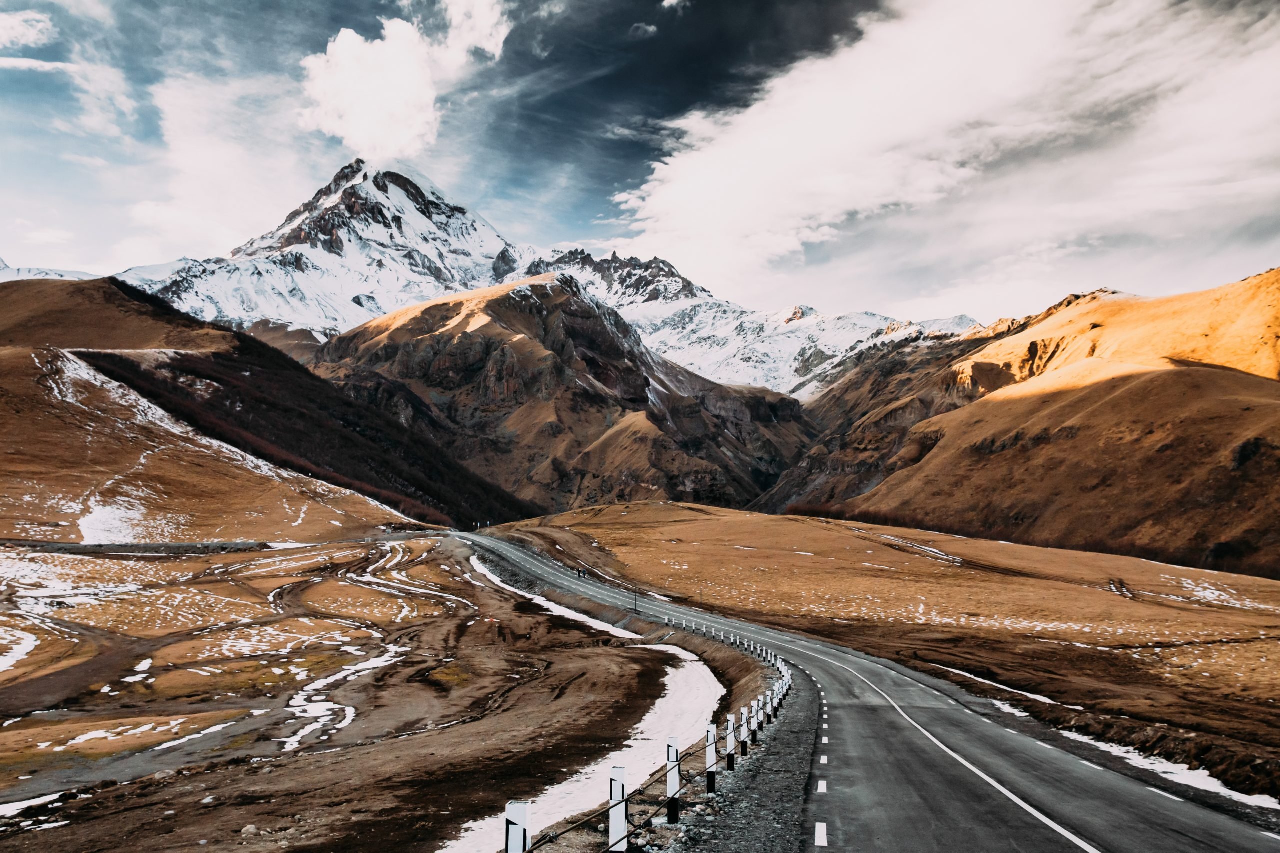 Gergeti, Georgia. Open Road To Peak Of Mount Kazbek In Autumn Se